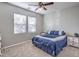 Comfortable bedroom with ceiling fan and large windows at 3026 English Palmer Rd, North Las Vegas, NV 89086