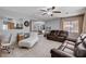 Spacious living room with leather sofas and a view into the dining area at 3153 Viewcrest Ave, Henderson, NV 89014