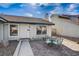 Small patio with a table and chairs, adjacent to the house entrance at 3153 Viewcrest Ave, Henderson, NV 89014