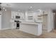 Modern kitchen with white cabinets and island at 3941 Hudson Bay Ave, Las Vegas, NV 89110