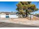 House for sale with a tree in front and a single car garage at 4690 E Utah Ave, Las Vegas, NV 89104