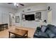 Living room with hardwood floors and a built-in entertainment center at 4690 E Utah Ave, Las Vegas, NV 89104