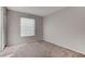 Well-lit bedroom with carpet flooring and a window with blinds at 5305 Rebecca Rd, Las Vegas, NV 89130