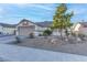 Single-story house with a two-car garage and gravel landscaping at 5305 Rebecca Rd, Las Vegas, NV 89130