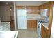 Bright kitchen with white appliances and wood cabinets at 6408 Sundown Heights Ave, Las Vegas, NV 89130