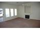 Bright living room featuring a fireplace and wall-mounted shelving at 6408 Sundown Heights Ave, Las Vegas, NV 89130