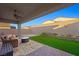 Covered patio, artificial turf, and sitting area at 688 Sunray Park St, Henderson, NV 89011