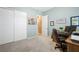 Home office with wood desk, chair, and closet at 688 Sunray Park St, Henderson, NV 89011