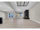 Spacious living room featuring a stone fireplace and light wood floors at 7000 Powderhorn Cir, Las Vegas, NV 89128