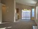 Spacious living room with sliding glass door to backyard at 8976 Quarrystone Way, Las Vegas, NV 89123