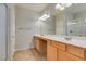 Double vanity bathroom with light wood cabinets at 10292 Kalang St, Las Vegas, NV 89178