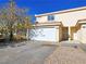 Two-story building with attached garage and front entry at 1050 Bourbon St, Pahrump, NV 89048