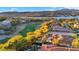 Stunning aerial view showcasing golf course, lake, and surrounding luxury homes at 2 Via Siena Pl, Henderson, NV 89011