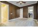 Bedroom with dark brown walls, ceiling fan and laundry access at 2 Via Siena Pl, Henderson, NV 89011