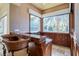 Dedicated wet bar area with wooden cabinets, a countertop, and window views at 2 Via Siena Pl, Henderson, NV 89011