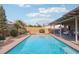 Stunning pool and backyard with patio and lounge chairs at 4761 Lake Pl, Las Vegas, NV 89147