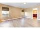 Bright bedroom featuring wood-look floors and a view of the backyard at 6608 Wind Whisper St, Las Vegas, NV 89148