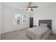 Bright bedroom with double windows, ceiling fan and plush carpet at 805 N Water St, Henderson, NV 89015