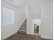 Upper-level hallway showcasing carpeted stairs and a window at 805 N Water St, Henderson, NV 89015