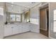 Bathroom features double vanity, large mirror, and a walk-in shower at 8967 Rolling Pietra St, Las Vegas, NV 89166