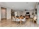 Open dining area with a large wooden table and modern chairs at 8967 Rolling Pietra St, Las Vegas, NV 89166