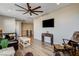 Relaxing sitting area with leather armchairs and a ceiling fan at 8967 Rolling Pietra St, Las Vegas, NV 89166