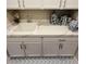 White shaker cabinets and quartz countertops highlight this laundry room at 10287 Ansley Bay Ave, Las Vegas, NV 89166