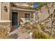 Front entrance with landscaping and brick walkway at 10590 Sturdevant Ct, Las Vegas, NV 89166