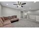 Spacious loft with sectional sofa and ceiling fan at 10590 Sturdevant Ct, Las Vegas, NV 89166