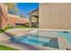 Relaxing spa with tiled coping and artificial turf at 10590 Sturdevant Ct, Las Vegas, NV 89166