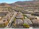 Aerial view of luxury homes in a gated community with mountain views at 11 Carolina Cherry Dr, Las Vegas, NV 89141