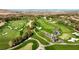 Aerial view of a lush golf course with a creek running through it at 11 Carolina Cherry Dr, Las Vegas, NV 89141