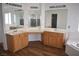 Large bathroom with double sinks, vanity, and wood cabinets at 1373 Blazing Sand St, Las Vegas, NV 89110