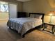 Bedroom featuring carpeted flooring, a bed, a nightstand, and a dresser at 1400 Santa Margarita St # B, Las Vegas, NV 89146