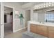 Bathroom features a double vanity and bench at 1413 October Oak Ave, Las Vegas, NV 89123