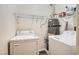 Convenient laundry room with washer, dryer, and shelving at 1628 Clint Canyon Dr, Henderson, NV 89002