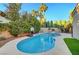 Sparkling pool with lush landscaping, a basketball hoop, and a privacy wall at 193 Webster Way, Henderson, NV 89074