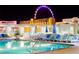 Night view of rooftop pool with city views at 211 E Flamingo Rd # 614, Las Vegas, NV 89169