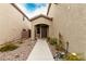 Front yard with walkway, landscaping, and a two car garage at 2456 Rue Bienville Way, Henderson, NV 89044