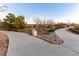 Curved walking path with landscaping and waste receptacle at 2456 Rue Bienville Way, Henderson, NV 89044