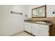 Bathroom with granite vanity and large mirror at 3045 Lindell Rd, Las Vegas, NV 89146