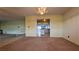 Bright dining room with chandelier and kitchen access at 3119 Desmond Ave, Las Vegas, NV 89121