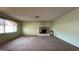 Spacious living room featuring a brick fireplace at 3119 Desmond Ave, Las Vegas, NV 89121