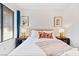 Bedroom with queen bed and gold patterned lamps at 321 Brookshire St, Henderson, NV 89015