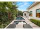 Inviting pool and spa surrounded by lush landscaping at 33 Owl Ridge Ct, Las Vegas, NV 89135