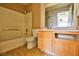 Clean bathroom with shower/tub combo, toilet and wood vanity at 4730 E Craig Rd # 2110, Las Vegas, NV 89115