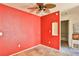 Small dining area with red walls and ceiling fan at 4730 E Craig Rd # 2110, Las Vegas, NV 89115