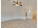 Spacious living room with tile flooring and a ceiling fan at 523 Coolidge Ave, Henderson, NV 89015