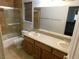 Bathroom with double vanity, shower/tub combo, and tile flooring at 6125 Blossom Knoll Ave, Las Vegas, NV 89108