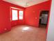 Bright dining room with red walls and tile floors at 6125 Blossom Knoll Ave, Las Vegas, NV 89108